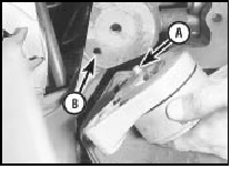 11.3 Withdrawing the coolant pump/alternator drivebelt tensioner assembly.