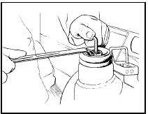 10.4 Removing the shock absorber top mounting nut - Saloon and Estate models