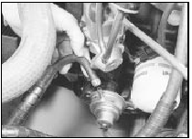 7.3 Disconnecting outlet hose from fuel pump - SOHC model