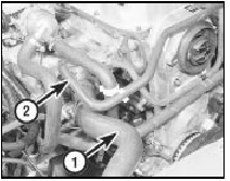 8.7 Disconnect the upper radiator hose (1) and the expansion tank hose (2)