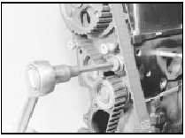 19.4 Loosening the timing belt tensioner spring bolt using a splined socket -