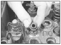 22.4 Removing a valve stem oil seal