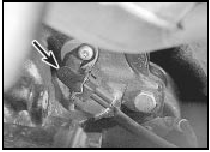 21.9 Crankshaft speed/position sensor (arrowed) viewed from front of engine