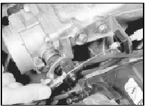 30.25b . . . and the throttle linkage