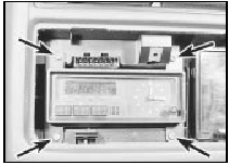 19.6 Multi-function digital/analogue clock securing screws (arrowed)