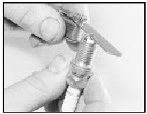 15.9 Measuring the spark plug gap with a feeler blade