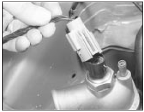 11.49a Disconnecting the cooling fan thermal switch . . .