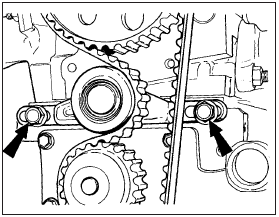 4.7 Timing belt tensioner retaining bolts (arrowed)