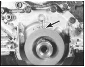 4.10a Crankshaft sprocket projection (arrowed) aligned with TDC mark on oil