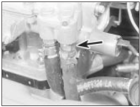 7.8 Fuel return pipe location (arrowed) - 1.4 litre carburettor engine