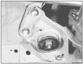 11.30b . . . and left-hand rear transmission mountings on pre-1986 models