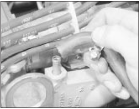 4.10 Disconnect the expansion tank hose at the thermostat housing - CVH