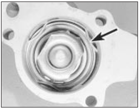 4.13a Extract the retaining spring clip (arrowed) . . .