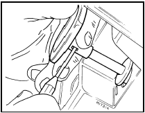 9.20 Using a small probe to release choke knob locking pin - 1986 models