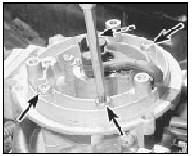 8.9 Unscrewing the CFI unit securing bolts (arrowed)